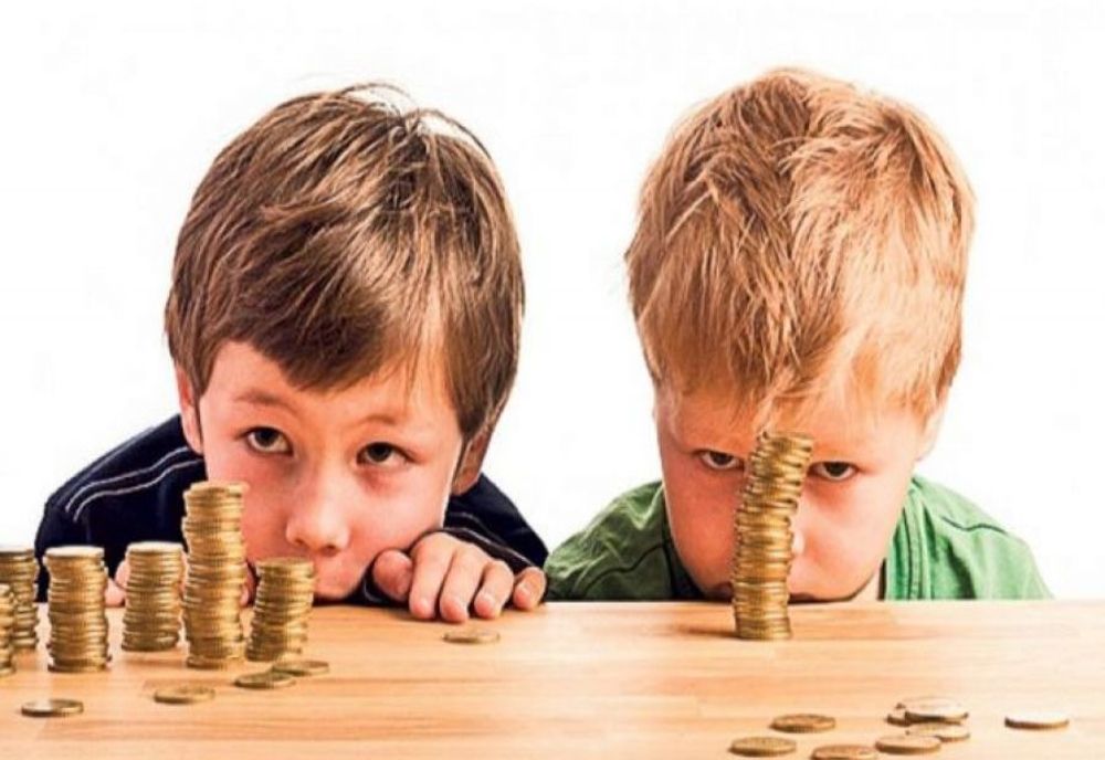 Johannis a promulgat legea de dublare a alocațiilor pentru copii